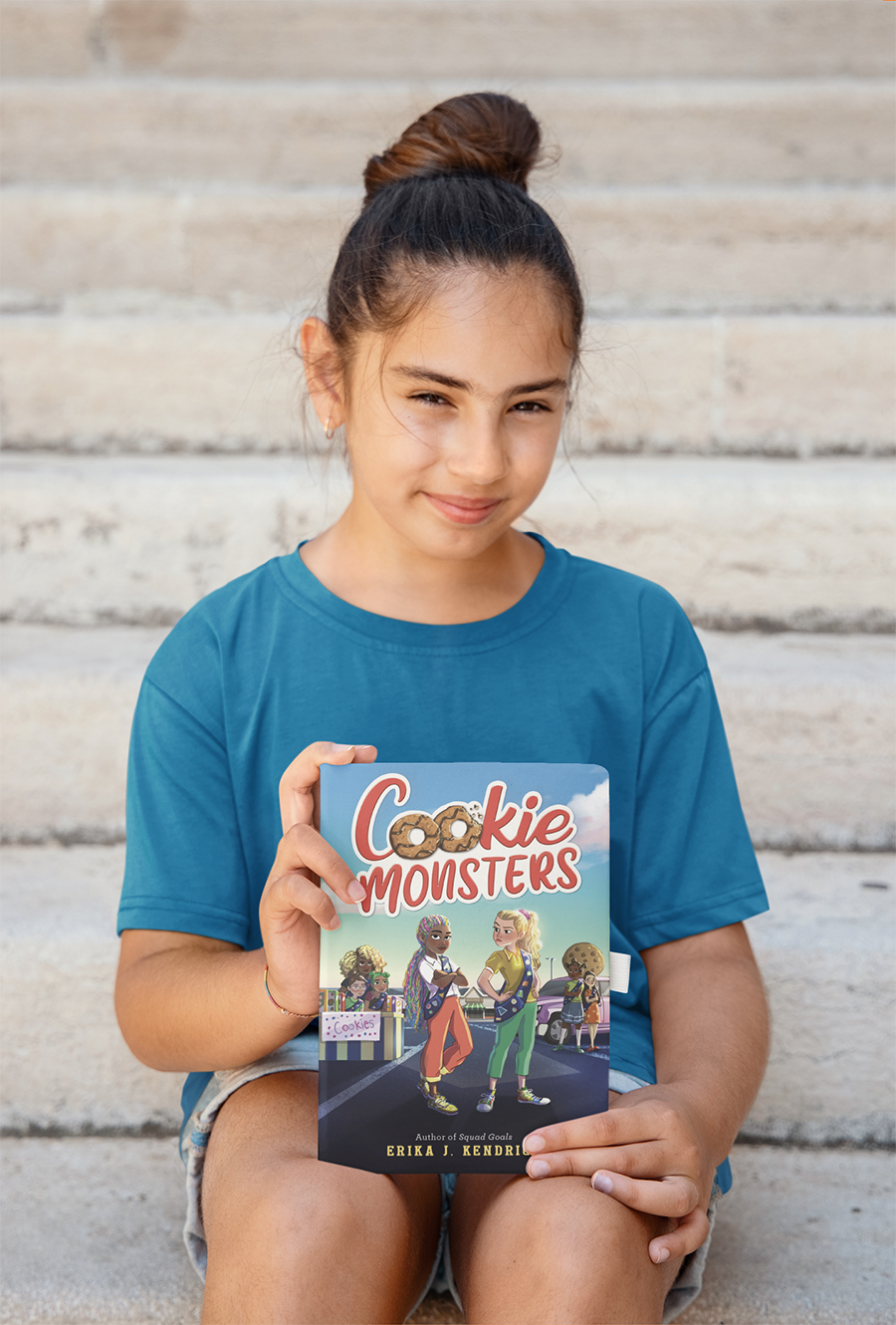 girl blue shirt holding cookie monsters 900